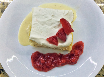 Tres Leches with Cream and Strawberry Sauce